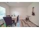 Light-filled dining room boasts modern flooring and ample space for entertaining at 8932 Myra Way, Charlotte, NC 28215