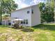 Backyard view of the home showing a covered patio and outdoor seating at 8932 Myra Way, Charlotte, NC 28215