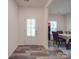 Welcoming foyer with hardwood floors, a modern interior door and natural light at 8932 Myra Way, Charlotte, NC 28215