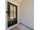 Stylish front door with glass panel, offers both curb appeal and security at 8932 Myra Way, Charlotte, NC 28215