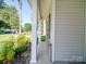 Inviting front porch with classic columns and landscaped garden at 8932 Myra Way, Charlotte, NC 28215