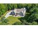 Aerial view of a charming residence surrounded by green trees at 423 Old Dutch Rd, Indian Trail, NC 28079