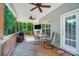 Relaxing screened-in porch with ceiling fans, a television, and an outdoor grill at 423 Old Dutch Rd, Indian Trail, NC 28079