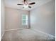 Bright bedroom with large window and a ceiling fan at 423 Old Dutch Rd, Indian Trail, NC 28079