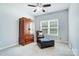 Bedroom with ceiling fan, ottoman, and chair at 423 Old Dutch Rd, Indian Trail, NC 28079