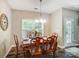 Dining room features a wood table with 6 chairs, chandelier and window at 423 Old Dutch Rd, Indian Trail, NC 28079