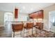 Charming kitchen bar area features granite countertops and seating, offering a perfect spot for casual dining at 423 Old Dutch Rd, Indian Trail, NC 28079