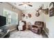 Cozy living room with two chairs and a ceiling fan, perfect for relaxing or entertaining at 423 Old Dutch Rd, Indian Trail, NC 28079