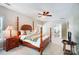 Elegant main bedroom with a four-poster bed, ceiling fan, and ample natural light, creating a serene and inviting atmosphere at 423 Old Dutch Rd, Indian Trail, NC 28079