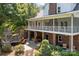 Home's exterior showcasing a large patio, hot tub, and fireplace at 721 Orphanage Rd, Concord, NC 28027