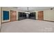 Finished basement with built-in shelving and ample space at 721 Orphanage Rd, Concord, NC 28027