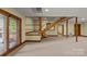 Finished basement with built-in bench seating and stairs at 721 Orphanage Rd, Concord, NC 28027