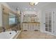 Luxurious bathroom with a soaking tub, glass shower, and double vanity at 721 Orphanage Rd, Concord, NC 28027