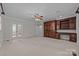 Large bedroom with built-in shelving and carpet flooring at 721 Orphanage Rd, Concord, NC 28027