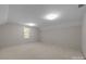 Well-lit bedroom with carpet and a window at 721 Orphanage Rd, Concord, NC 28027