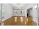 Elegant dining room with hardwood floors and a stunning chandelier at 721 Orphanage Rd, Concord, NC 28027