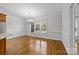 Bright dining room with hardwood floors and large windows at 721 Orphanage Rd, Concord, NC 28027