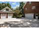 Two-car attached garage and detached two-car garage with ample parking at 721 Orphanage Rd, Concord, NC 28027