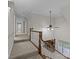 Upstairs hallway with carpeted flooring and ceiling fan at 721 Orphanage Rd, Concord, NC 28027