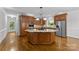 Spacious kitchen with island, stainless steel appliances, and hardwood floors at 721 Orphanage Rd, Concord, NC 28027