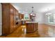 Spacious kitchen with island, stainless steel appliances, and hardwood floors at 721 Orphanage Rd, Concord, NC 28027