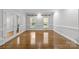 Bright office with hardwood floors and built-in shelving at 721 Orphanage Rd, Concord, NC 28027