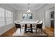 Bright dining area with modern light fixture and hardwood floors at 902 Snow Prince Ln, York, SC 29745