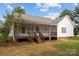 House exterior showcasing a screened porch and yard at 902 Snow Prince Ln, York, SC 29745