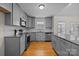 Modern kitchen with gray cabinets and granite countertops at 902 Snow Prince Ln, York, SC 29745