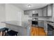 Modern kitchen with gray cabinets and granite countertops at 902 Snow Prince Ln, York, SC 29745