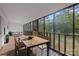 Screened porch with wooden dining table and seating at 902 Snow Prince Ln, York, SC 29745