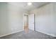 Bedroom with access to hallway and carpet at 1517 28Th Street Se Pl, Hickory, NC 28602