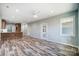 Open living room with wood-look floors and access to patio at 1517 28Th Street Se Pl, Hickory, NC 28602