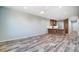 Open living room with kitchen island and wood-look floors at 1517 28Th Street Se Pl, Hickory, NC 28602