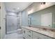 Double vanity bathroom with granite countertop and shower at 1523 28Th Street Se Pl, Hickory, NC 28602