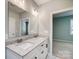 Double vanity bathroom with granite countertop and mirror at 1523 28Th Street Se Pl, Hickory, NC 28602