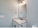 Clean bathroom featuring a white vanity with granite countertop and a large mirror at 1523 28Th Street Se Pl, Hickory, NC 28602