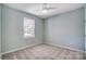 Well-lit bedroom with carpet and ceiling fan at 1523 28Th Street Se Pl, Hickory, NC 28602