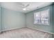 Bright bedroom with neutral carpet and ceiling fan at 1523 28Th Street Se Pl, Hickory, NC 28602