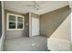 Covered patio with ceiling fan, concrete flooring and exterior storage at 1523 28Th Street Se Pl, Hickory, NC 28602