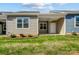 Rear exterior view showing a covered patio and grassy area at 1523 28Th Street Se Pl, Hickory, NC 28602