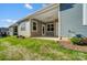 Back exterior showcasing a covered patio and well-maintained landscaping at 1523 28Th Street Se Pl, Hickory, NC 28602