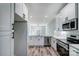 Stainless steel appliances and white shaker cabinets in kitchen at 1523 28Th Street Se Pl, Hickory, NC 28602