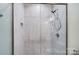 Shower with light gray tile and glass enclosure at 1523 28Th Street Se Pl, Hickory, NC 28602