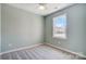 Spacious bedroom with large window and ceiling fan at 1529 28Th Street Se Pl, Hickory, NC 28602