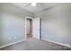 Simple bedroom with carpet, neutral walls, and door to another room at 1529 28Th Street Se Pl, Hickory, NC 28602