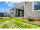 Townhouse exterior with gray siding, landscaping, and a patio at 1529 28Th Street Se Pl, Hickory, NC 28602