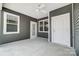 Covered patio with ceiling fan, concrete flooring, and exterior door at 1529 28Th Street Se Pl, Hickory, NC 28602