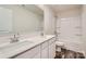 Clean bathroom with double sinks, white cabinets, and a shower/tub combo at 1610 Cannonball Ln, Bessemer City, NC 28016