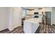 Modern kitchen with white cabinets, quartz countertops, and stainless steel appliances at 1610 Cannonball Ln, Bessemer City, NC 28016